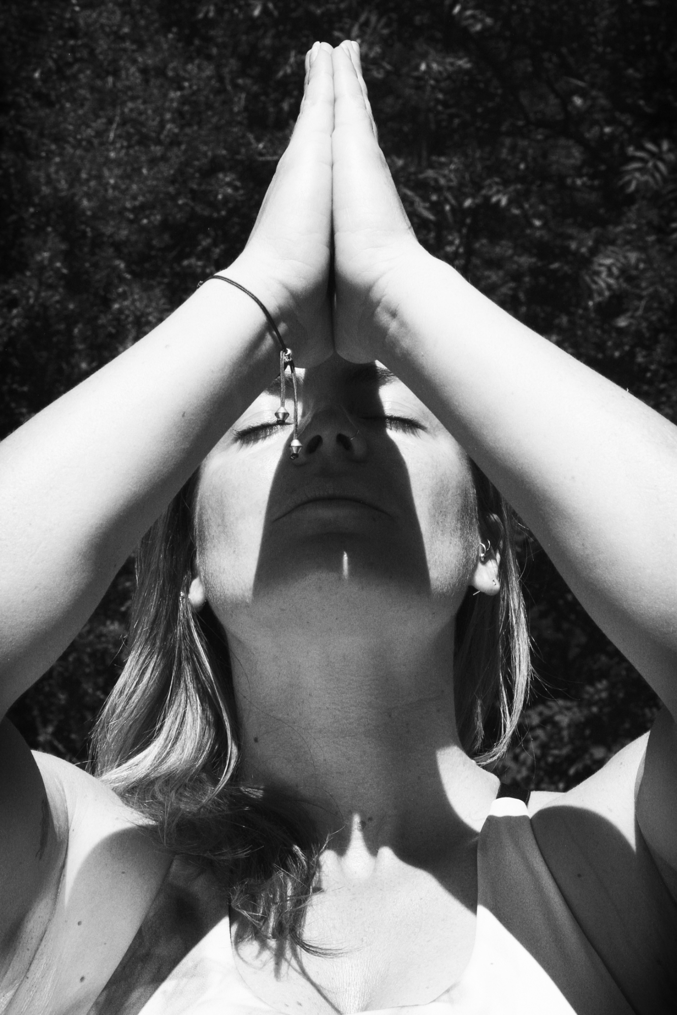 A yoga practitioner in prayer pose.