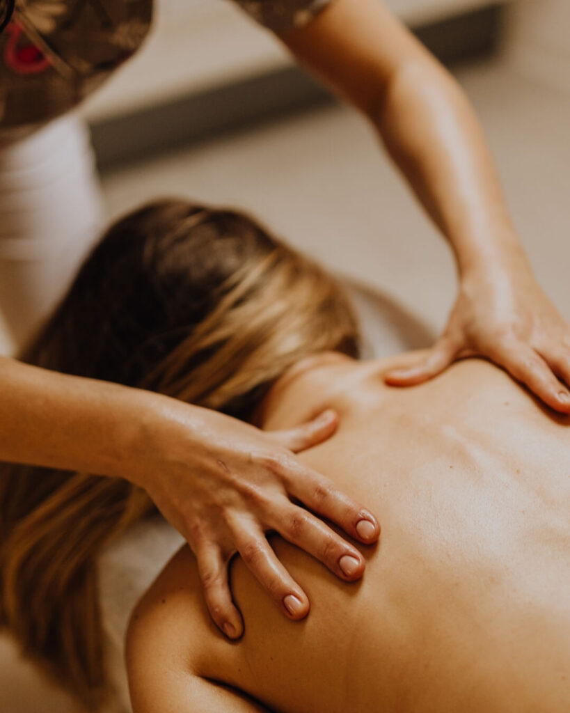 Woman receiving a back massage.