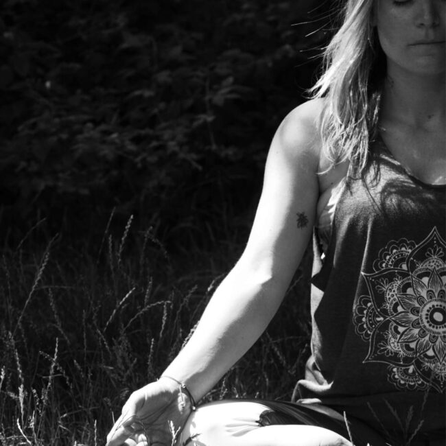 black and white female doing meditation