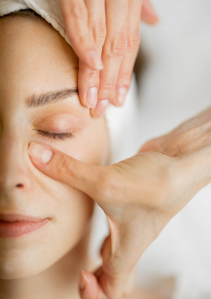 woman receiving facial massage