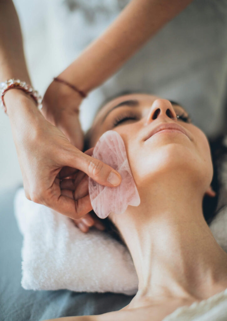 woman receiving gua gha treatment